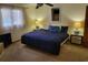 Cozy bedroom with ceiling fan, bedside lamps, and natural light from the window at 207 Double Eagle Dr. # E-1, Surfside Beach, SC 29575