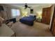 Bedroom featuring neutral walls, ceiling fan, and a comfortable bed setting at 207 Double Eagle Dr. # E-1, Surfside Beach, SC 29575