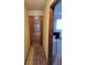 Front entry door with ceramic tile flooring and rug to the left at 207 Double Eagle Dr. # E-1, Surfside Beach, SC 29575