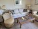 Bright living room features a neutral sofa, stylish coffee table, and lamps at 207 Double Eagle Dr. # E-1, Surfside Beach, SC 29575