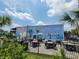 Outdoor seating area with mural advertising Surfside Beach, South Carolina at 207 Double Eagle Dr. # E-1, Surfside Beach, SC 29575