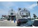 View of the Surfside Beach Pier featuring parking and various attractions at 207 Double Eagle Dr. # E-1, Surfside Beach, SC 29575