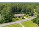 Aerial view of home featuring a lush, landscaped yard and picturesque surroundings at 2135 Starduster Ln., Little River, SC 29566