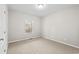 Neutral bedroom featuring a window that provides plenty of natural light at 2135 Starduster Ln., Little River, SC 29566