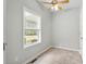 Bright bedroom with a ceiling fan and a window offering a view of the outdoors at 2135 Starduster Ln., Little River, SC 29566