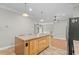 The kitchen island overlooks the open floor plan of this lovely home at 2135 Starduster Ln., Little River, SC 29566