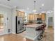 Bright kitchen with wood cabinets, stainless steel appliances, and a breakfast bar that seats three at 2135 Starduster Ln., Little River, SC 29566