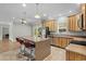 Open kitchen features wood cabinets, breakfast bar, and stainless steel appliances in this home at 2135 Starduster Ln., Little River, SC 29566