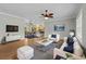A comfortable living room with plush seating, stylish decor, and an open view to the dining area at 2135 Starduster Ln., Little River, SC 29566
