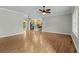 Spacious living room with laminate floors seamlessly connecting to the open kitchen area at 2135 Starduster Ln., Little River, SC 29566