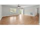 A spacious living room features laminate flooring, neutral paint, and a bright back door entrance at 2135 Starduster Ln., Little River, SC 29566