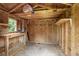 Inside a storage shed featuring workbench with shelves and a window at 2135 Starduster Ln., Little River, SC 29566