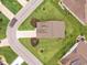 Overhead aerial view of a landscaped home with mature trees, cul-de-sac and sidewalk at 2143 Stonecrest Dr. Nw, Calabash, NC 28467