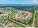 Community aerial view of a golf course and lake community with mature trees and well maintained lawns at 2143 Stonecrest Dr. Nw, Calabash, NC 28467