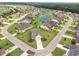 An aerial view of a neighborhood with homes surrounding a small lake and cul-de-sac at 2143 Stonecrest Dr. Nw, Calabash, NC 28467