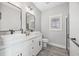 Modern bathroom features double vanities, vessel sinks, white cabinets, and neutral finishes at 2143 Stonecrest Dr. Nw, Calabash, NC 28467