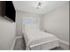 Well-lit bedroom features a plush queen bed, side table, and a large window at 2143 Stonecrest Dr. Nw, Calabash, NC 28467