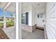 Welcoming front porch featuring brick accents, sturdy support columns, and an inviting white front door at 2143 Stonecrest Dr. Nw, Calabash, NC 28467
