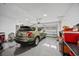 View of an organized two car garage with speckled floor and storage space at 2143 Stonecrest Dr. Nw, Calabash, NC 28467