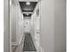 Bright hallway with a decorative ceiling, leading to the front door and other areas of the home at 2143 Stonecrest Dr. Nw, Calabash, NC 28467