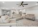 Spacious living room with neutral decor, open to the kitchen, and complete with a ceiling fan at 2143 Stonecrest Dr. Nw, Calabash, NC 28467