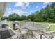 Enjoy outdoor living on this back deck with grill, dining table and chairs at 241 Fannie B Rd., Conway, SC 29526