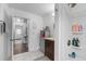 Bright bathroom features a shower, vanity with storage, and white tile flooring at 241 Fannie B Rd., Conway, SC 29526