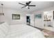Comfortable bedroom with ceiling fan, ample sunlight, and ensuite access to a bathroom at 241 Fannie B Rd., Conway, SC 29526