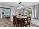 Formal dining room showcases an elegant lighting fixture and natural lighting at 241 Fannie B Rd., Conway, SC 29526