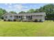 Charming home exterior featuring a well-kept lawn, inviting porch, and manicured landscaping at 241 Fannie B Rd., Conway, SC 29526