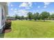Spacious front lawn featuring well-manicured grass, mature trees, and beautiful sky at 241 Fannie B Rd., Conway, SC 29526