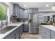 Modern kitchen with gray cabinets, stainless steel appliances, and tiled backsplash at 241 Fannie B Rd., Conway, SC 29526