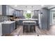 Modern kitchen with gray cabinets, stainless steel appliances, and a tiled backsplash at 241 Fannie B Rd., Conway, SC 29526
