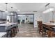 Inviting kitchen and dining area with open layout, gray cabinets, and wood floors at 241 Fannie B Rd., Conway, SC 29526