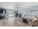 Spacious living room featuring modern fan, wood floors, and neutral paint at 241 Fannie B Rd., Conway, SC 29526