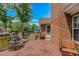 A spacious deck features a seating area with a brick exterior and treed yard at 2454 Glen Dr., Little River, SC 29566