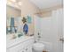 Clean bathroom with a vanity, toilet, and shower-tub combo at 2454 Glen Dr., Little River, SC 29566