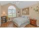 Comfortable bedroom with hardwood floors, a large window, and tasteful decorations at 2454 Glen Dr., Little River, SC 29566