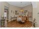 Cozy dining room featuring hardwood floors, a chandelier, and views to the outside at 2454 Glen Dr., Little River, SC 29566