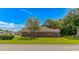 Charming brick home with manicured lawn and mature trees offering a serene and inviting curb appeal at 2454 Glen Dr., Little River, SC 29566