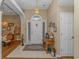 Inviting foyer with a chandelier, tile flooring, and a glimpse into the dining room at 2454 Glen Dr., Little River, SC 29566