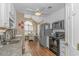 Well-lit kitchen featuring white cabinets, granite countertops, and stainless steel appliances at 2454 Glen Dr., Little River, SC 29566