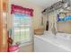 Functional laundry room with a window, washer, and dryer at 2454 Glen Dr., Little River, SC 29566