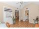 An open concept living room leads to bedroom and bathroom, with light walls and modern flooring at 2454 Glen Dr., Little River, SC 29566