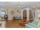 Open concept living area with hardwood floors and views into the dining room and kitchen at 2454 Glen Dr., Little River, SC 29566