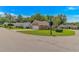 View of the home at the corner of two quiet, residential streets, featuring a detached garage and well-kept landscaping at 2454 Glen Dr., Little River, SC 29566