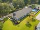 Aerial view showcases this charming property with a pool, shed, and well-manicured yard at 2588 Long Avenue Ext., Conway, SC 29526