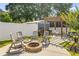 Backyard with a fire pit, grill, and a pergola perfect for outdoor entertaining at 2588 Long Avenue Ext., Conway, SC 29526