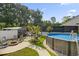 Inviting backyard with an above ground pool, a fire pit, a grill and a cozy pergola with string lights at 2588 Long Avenue Ext., Conway, SC 29526