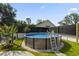 Backyard features an above ground pool bordered with white gravel and a safety ladder at 2588 Long Avenue Ext., Conway, SC 29526